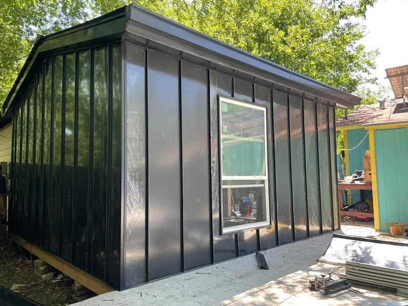 Black standing seam metal wall panels for Roof Inspection in Weisenberg